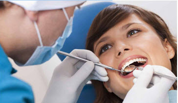 Visiting a dentist regularly to ensure healthy teeth